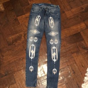 Embroidered fade to blue jeans